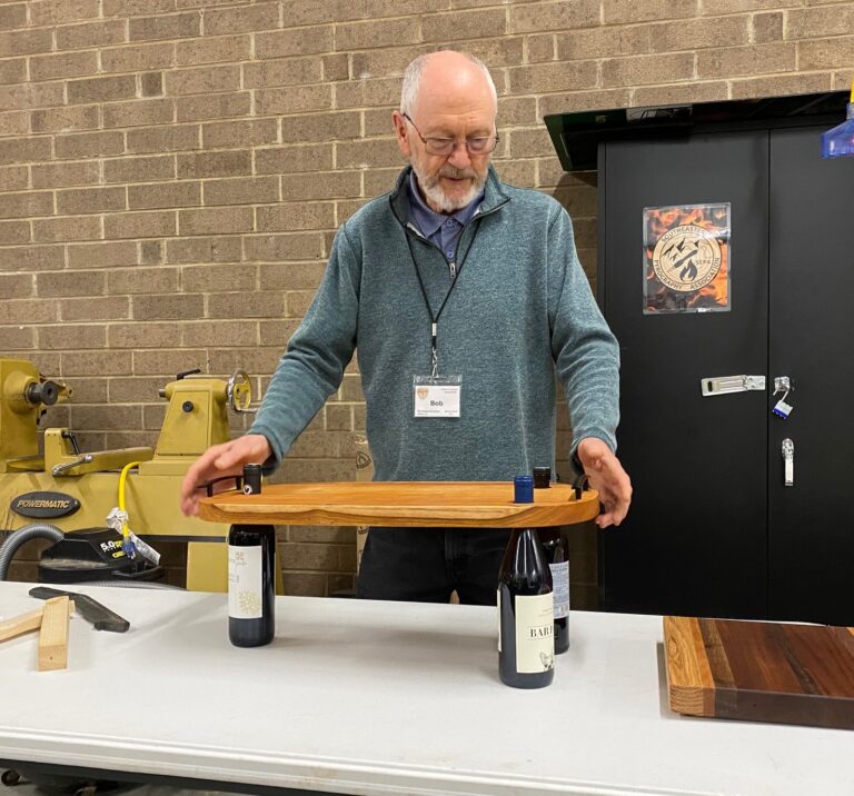Bob's charcuterie board with wine bottles
