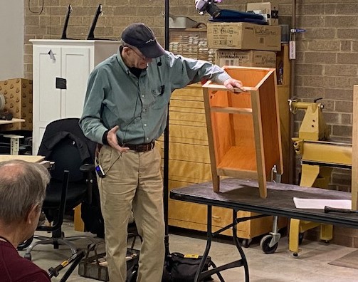 John Ferguson demonstrates how to cut and fit a bottom panel into furniture project.